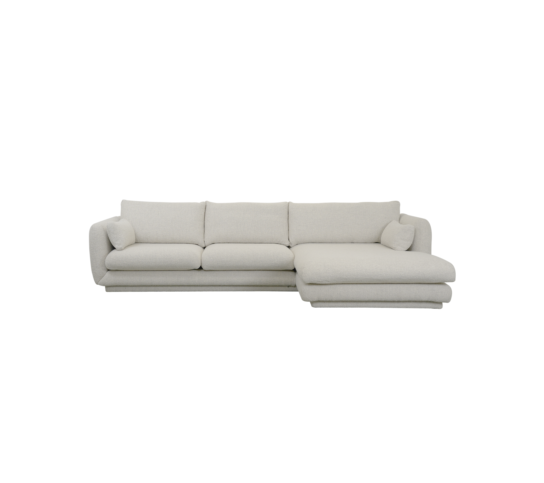Sofa moderne couleur sable avec des lignes épurées et des coussins doux.